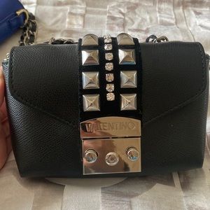 Tiny black bag (Valentino by Mario) in good condition.
